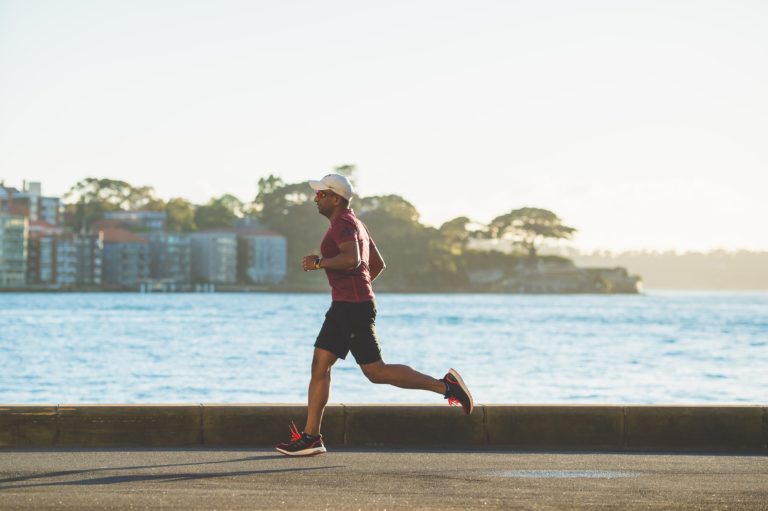 Man running near water